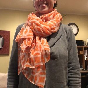 Selling orange and white scarf with a design